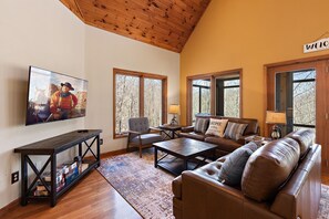 Comfortable Living Room with Leather Furniture and TV