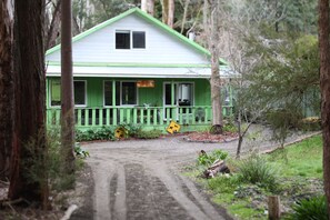 Gravel driveway down to the house.