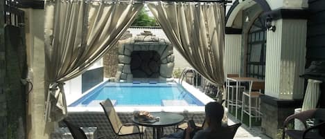 Gazebo area with seating area pool view