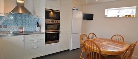 The dining kitchen is fully fitted