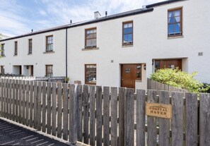The enclosed courtyard garden is situated within a quiet neighbourhood