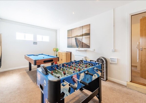 The garage has been converted into a spacious games room