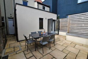 Step out the kitchen into the enclosed courtyard