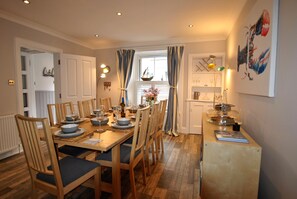 The formal dining area has plenty space for eight guests