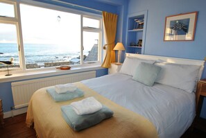 The double bedroom has uninterrupted sea views