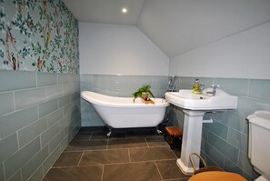 A decadent bathroom with slipper bath