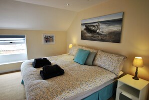 Quality bedding and towels are provided