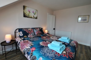 The master bedroom has a comfortable double bed.