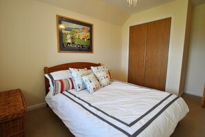 The double bedroom is decorated in neutral shades