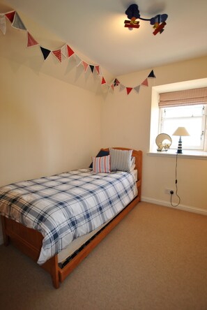 The twin bedroom can be set as a single as required