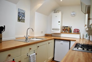 Prepare fresh, local produce in the well-equipped galley kitchen