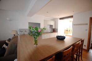 Sit at the breakfast bar in this spacious and characterful open plan kitchen