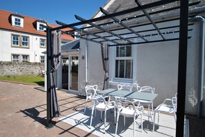 Enjoy the outdoor seating and barbecue