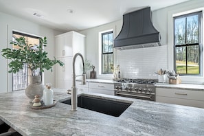 Amazing kitchen with commercial style 6 burner range and granite countertops