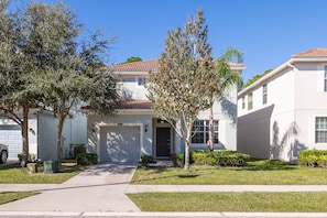 Bright, sunny front entry with parking available for 1 vehicle