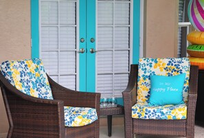 Lanai furniture outside primary bedroom by the pool and spa