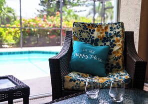 Lanai furniture by the pool and spa