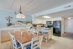 There is plenty of space for meals in with seating at the dining table as well as the breakfast bar