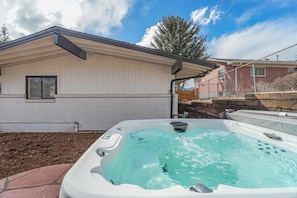 Whether it's a night in or a chilly day, the hot tub is perfect for enjoying with family and friends! Keep in mind this is a shared hot tub with the other unit on the property!