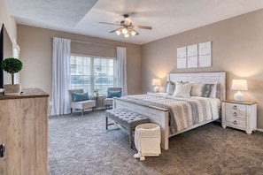 The primary bedroom features a king bed and lots of extra space!