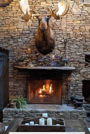 Great room fireplace overseen by Maurice the Moose