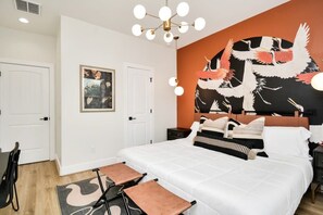 Crane Room features a king bed with mid century modern lighting accents. Large private en suite bathroom.