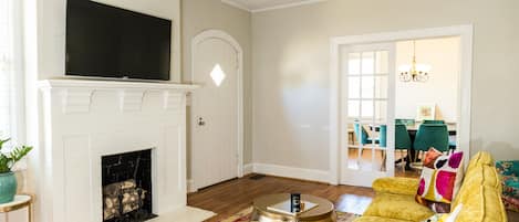 Living room with view into dining room