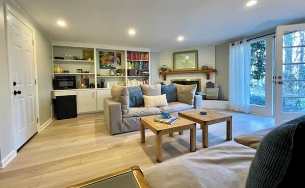 Living room with with lots of light and door onto the patio