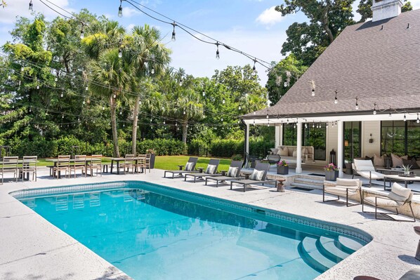 This huge backyard is one highlight of the home with a pool and tons of seating.