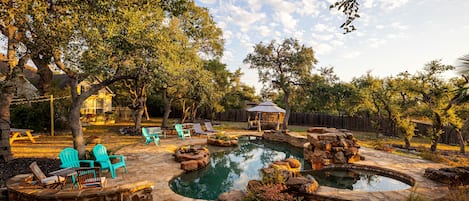 Resort-Style Pool with waterfall features, beach entry and lots of space to hang