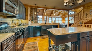 Spacious kitchen with bar stool seating.