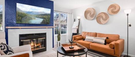 Living room with Smart TV & wood burning fireplace