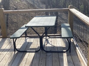 Picnic on the deck, anyone?  Built in grill is by the front door.   