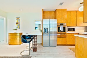 Kitchen with counter seating for 2 people