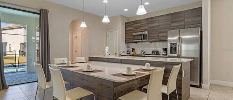 Kitchen and dining area leading to the pool