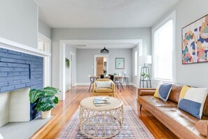 Living room with Smart TV and games.