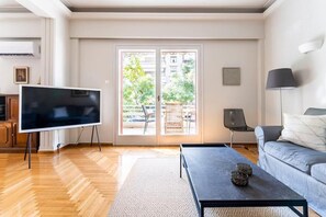 Living room, in direct contact with the spacious balcony, garden  & smart TV