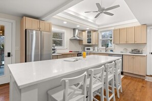 This fully equipped kitchen features stainless steel appliances, and plenty of counter space for meal preparation.