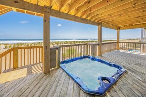 An in-deck 4-person hot tub on the second level deck awaits to soothe you after a day of swashbuckling in the sun.