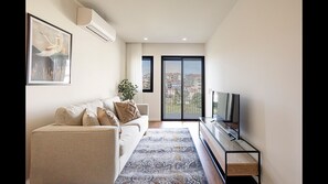 Our spacious living area, counts with a TV and an AC unit, for your convenience! #stunning #modern