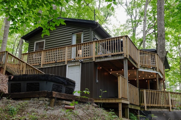 Outdoor space has 2 decks and a hot tub. 