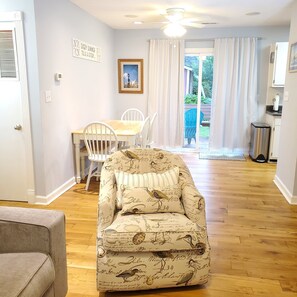 Living / Dining area lead to a sliding door and large, fenced back yard.