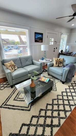 Comfortable seating in front of entertainment center, living room