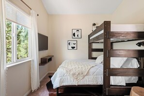 2nd bedroom with queen bed and single bunk bed. TV with Roku.