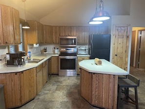 Fully stocked Kitchen with pod/pot coffee maker and convection toaster oven.