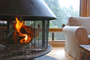 Cozy up to a crackling fire while enjoying the natural light in the great room.