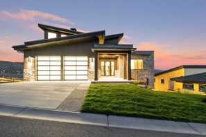 Spacious garage and driveway with total parking for 4 full size vehicles