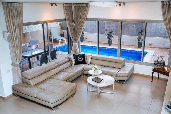Living room Access to The Private Pool