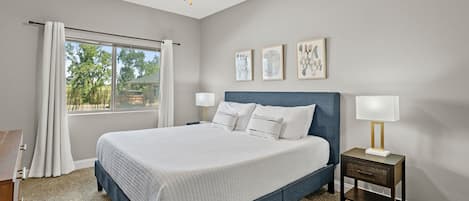 The bedroom with an ultra comfortable, 12" memory foam KING mattress, room darkening curtains, smart TV and more!