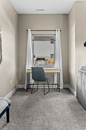 The office nook in the living room has a desk which is great for work, school, studying, games and more.